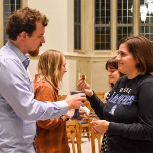Dave Allen serving Communion