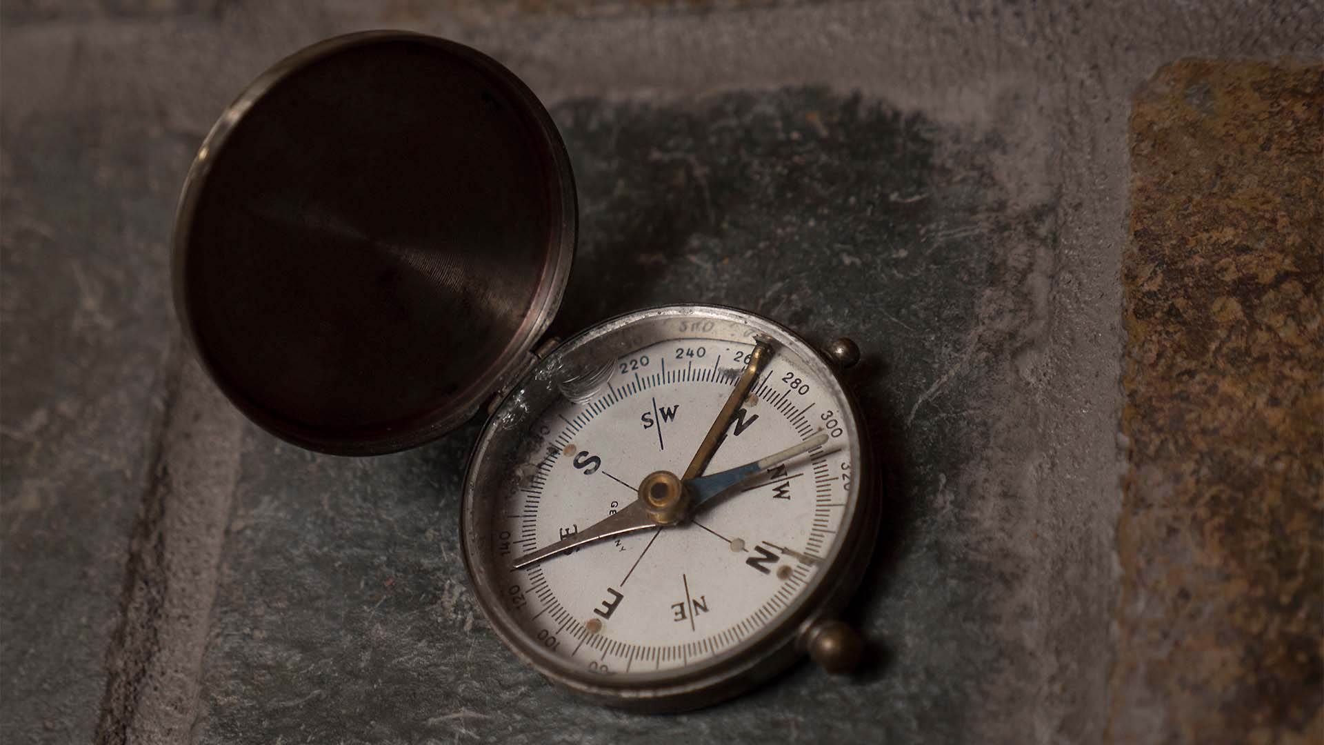 Compass laying on stone floor