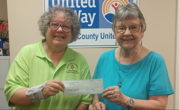 Donna Brander receives check from United Way