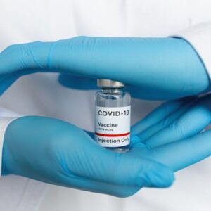 hands holding covid-19 vaccine