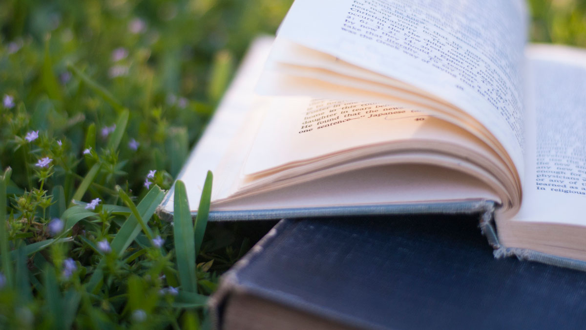 books in grass