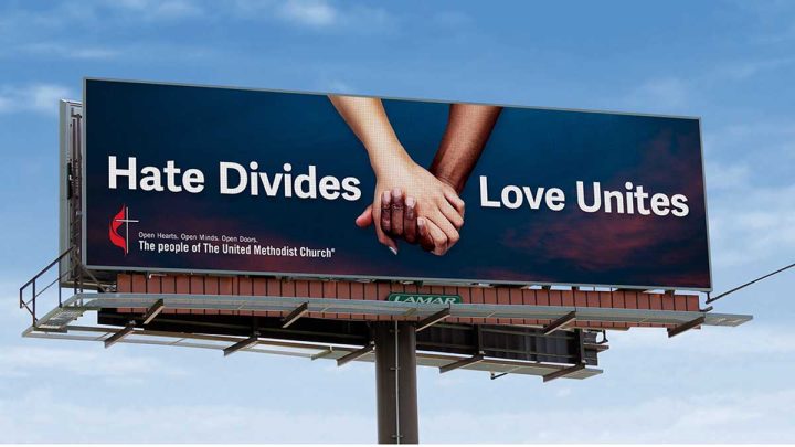 Billboard reads "Hate Divides, Love Unites"