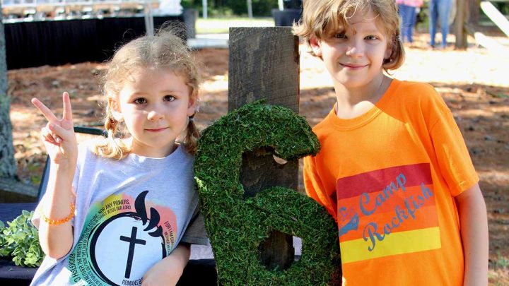 Two children pose at Camp Rockfish