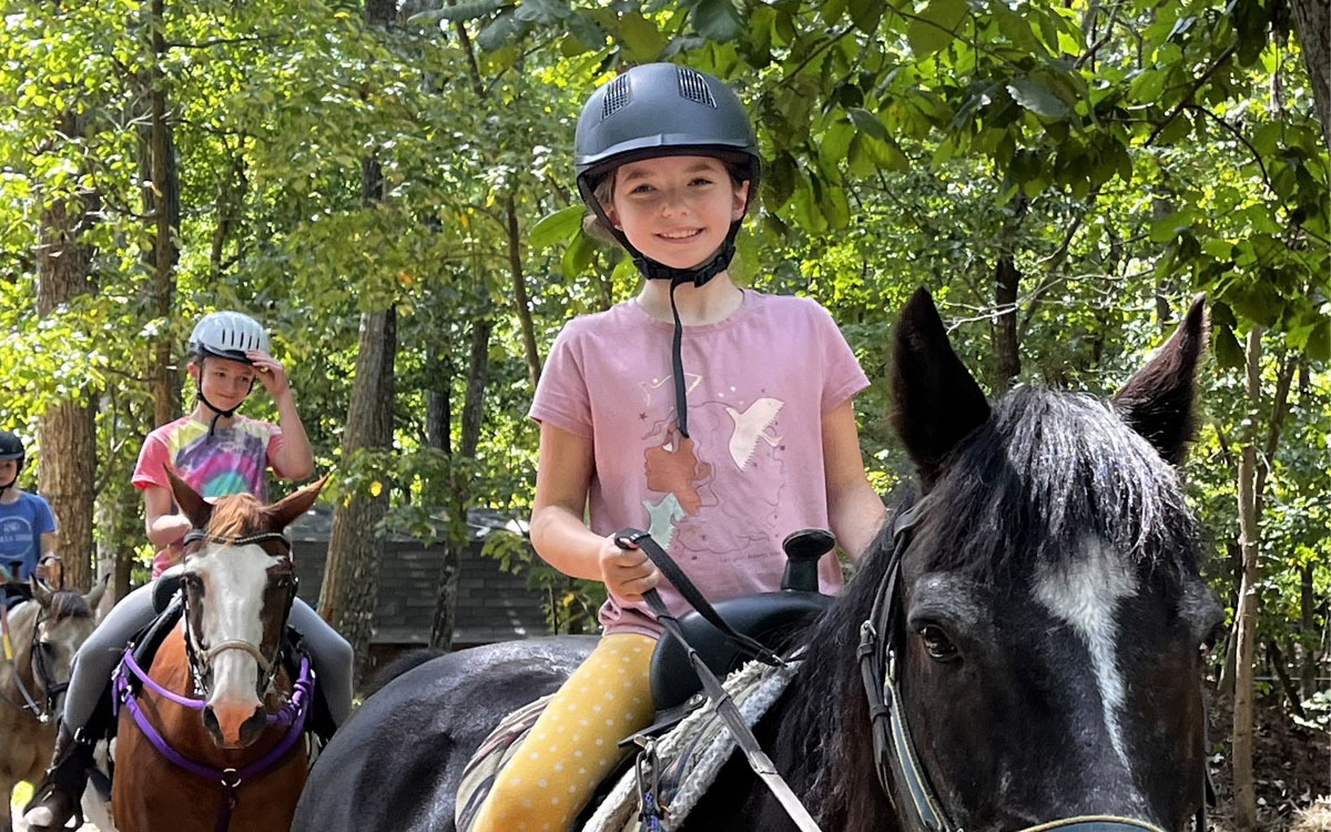 two children on ponies