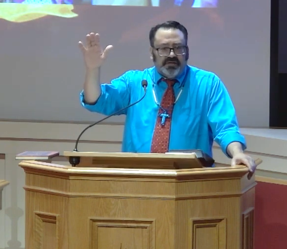 Rev. Mattheue B. Locklear preaches from the pulpit.